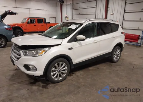 2017 Ford Escape Titanium z USA, uszkodzony, nr VIN 1FMCU0J96HUC25652
